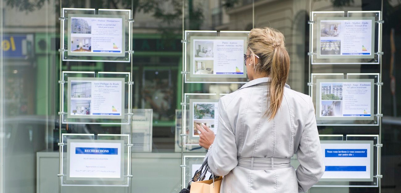 woman looking at real estate ads