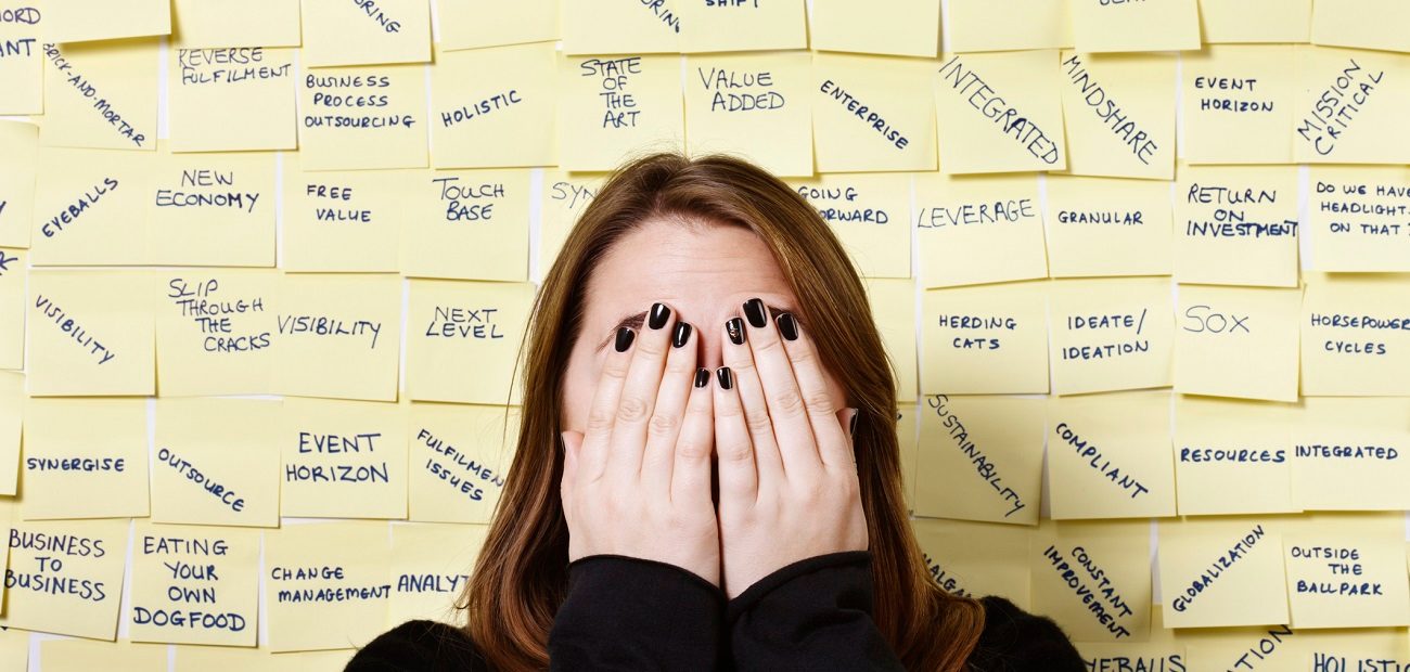 woman hides from excess of business buzzwords