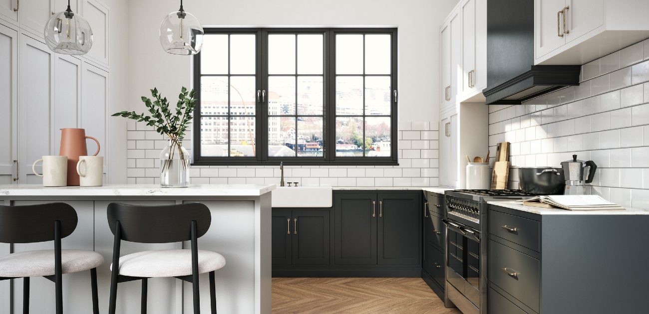 A newly remodeled kitchen with black and white for colors and industrial chic for lighting and appliances.