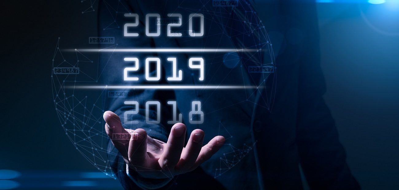 businessman points to futuristic years hologram