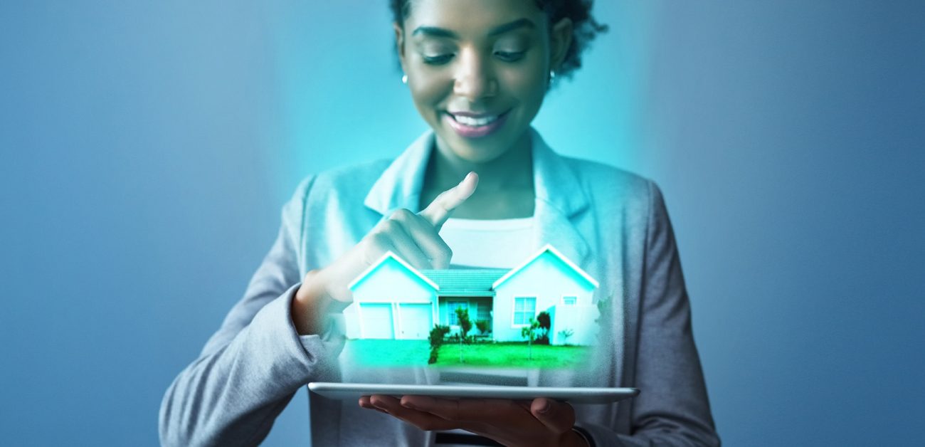 concept photo, woman looking at 3-D house on tablet