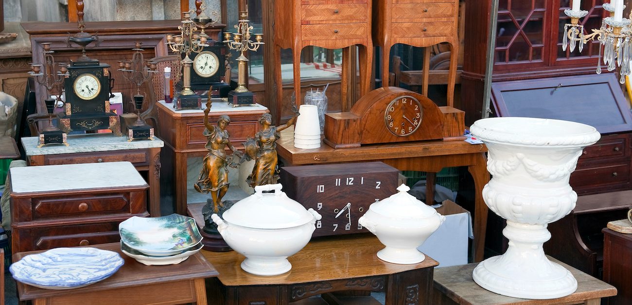 Several antique vases, clocks, and pieces of furniture.
