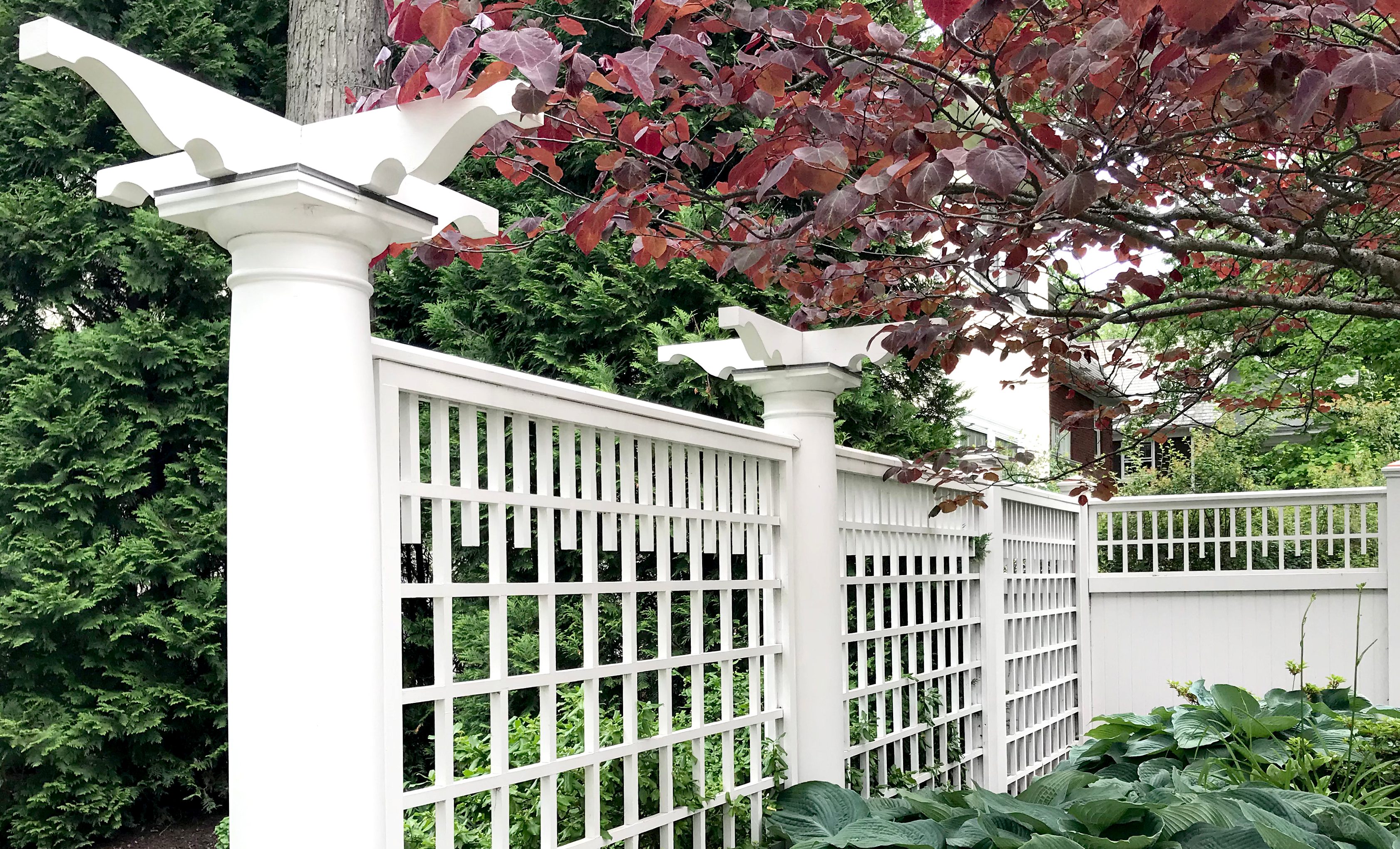 Decorative white trellis fence