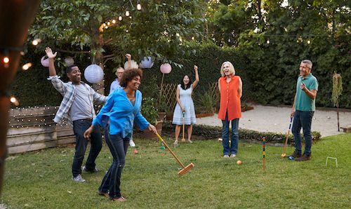 Backyard game of croquet between friends