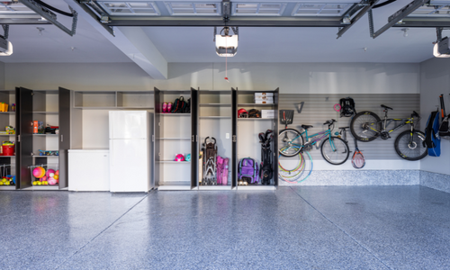 A large garage with lots of wall and cabinet storage