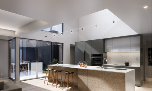 A modern kitchen with skylights and glass doors