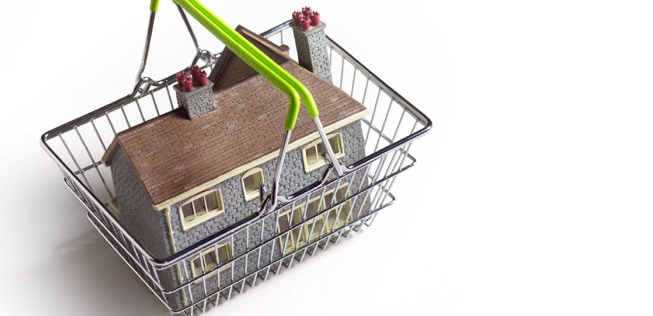 A graphic of a shopping basket with a house in it.