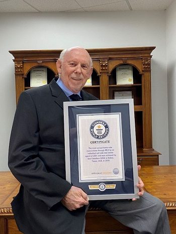 Caballero holds a plaque reflecting his 2020 Guinness World Record title