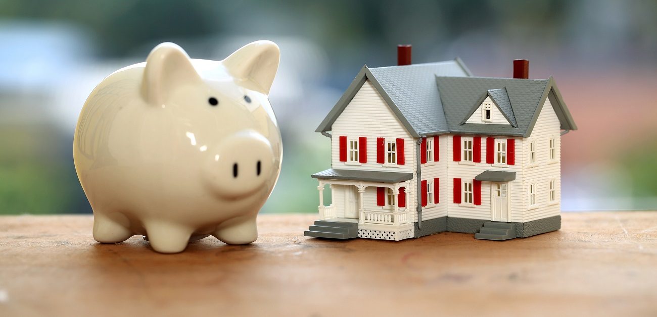 Piggy bank and miniature house