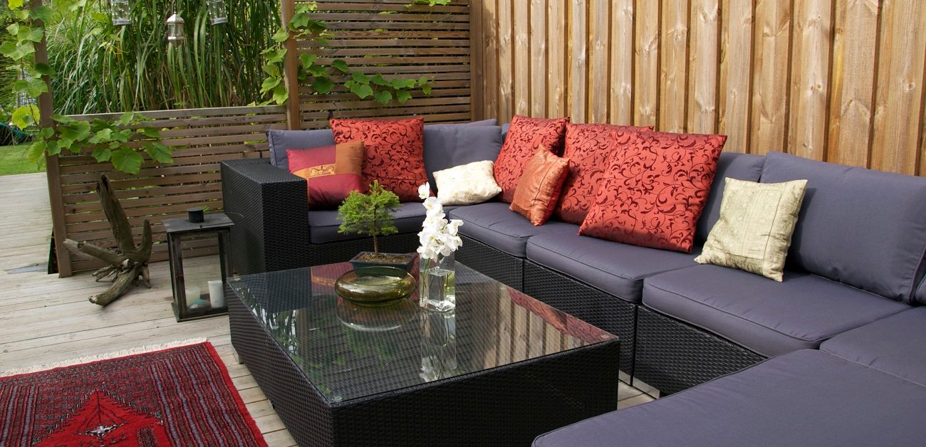 Contemporary patio with large wicker sofa
