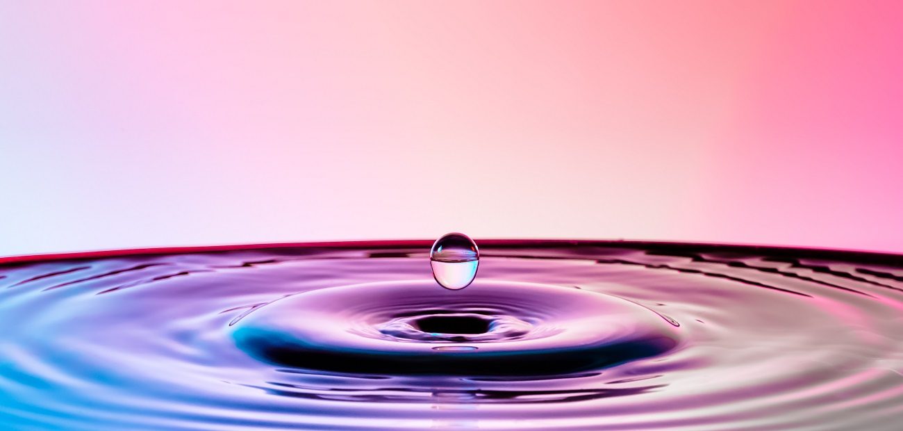 Close-Up Of Droplet Splashing In Water