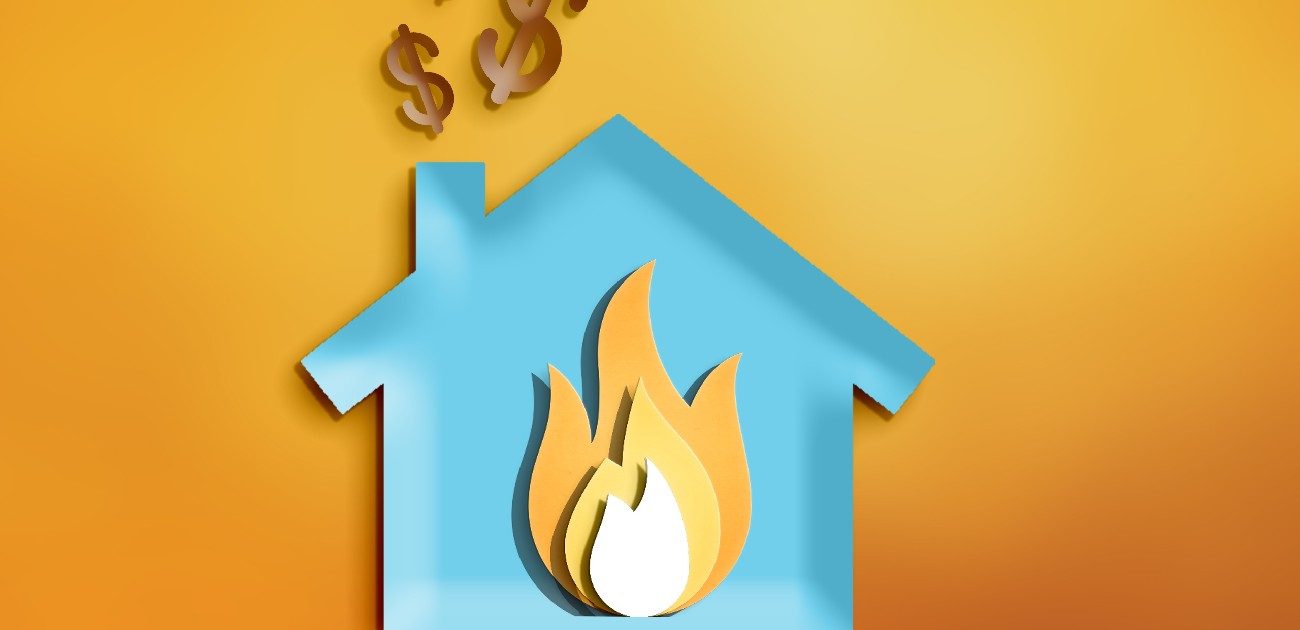 A graphic of a house with a flame in the center of it in the style of construction paper crafts.
