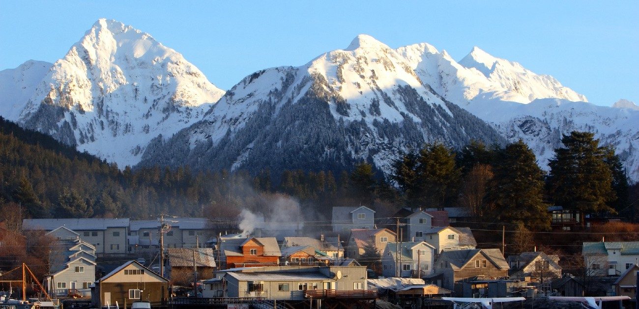 Picture of a residential area and mountains in the background.