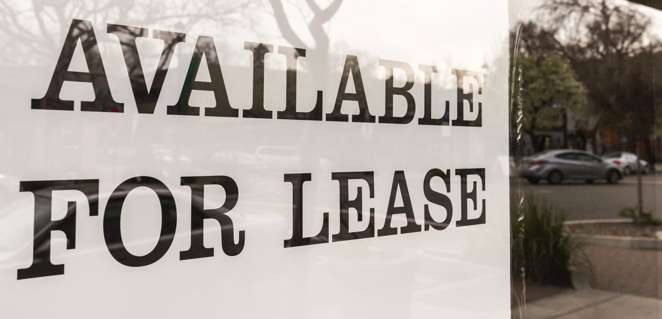 space for lease sign in vacant storefront