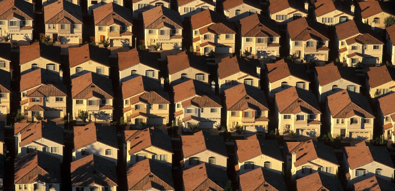 An aerial photograph of numerous identical houses.