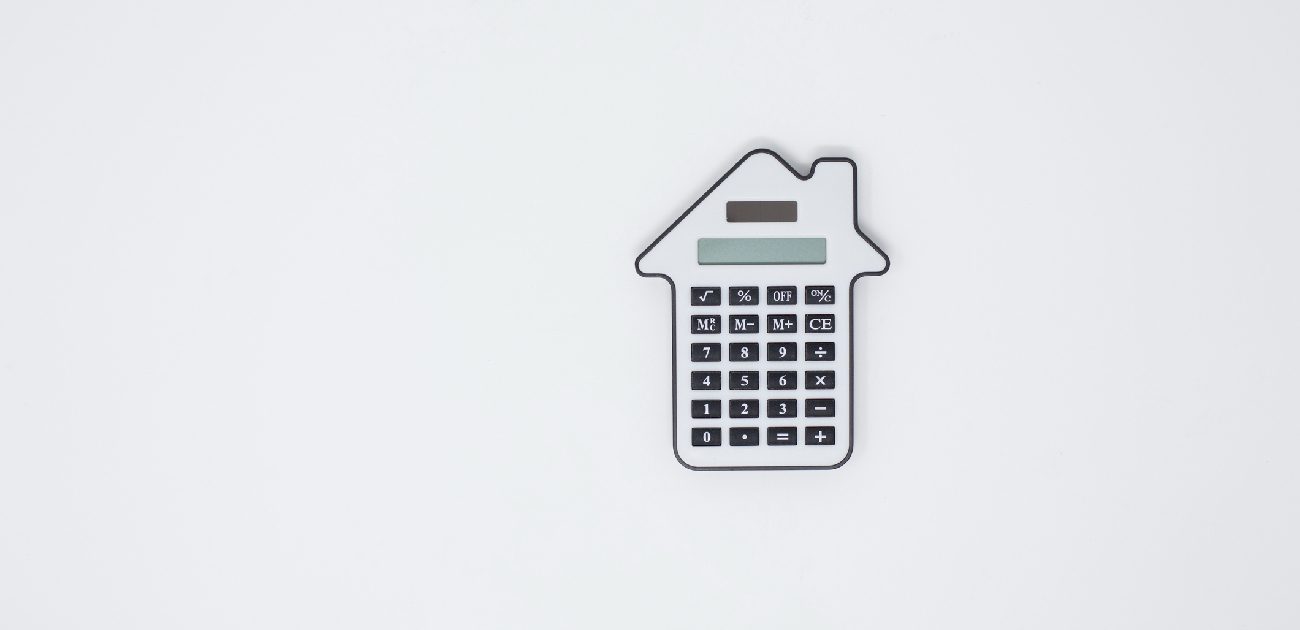 An image of a calculator in the shape of a house