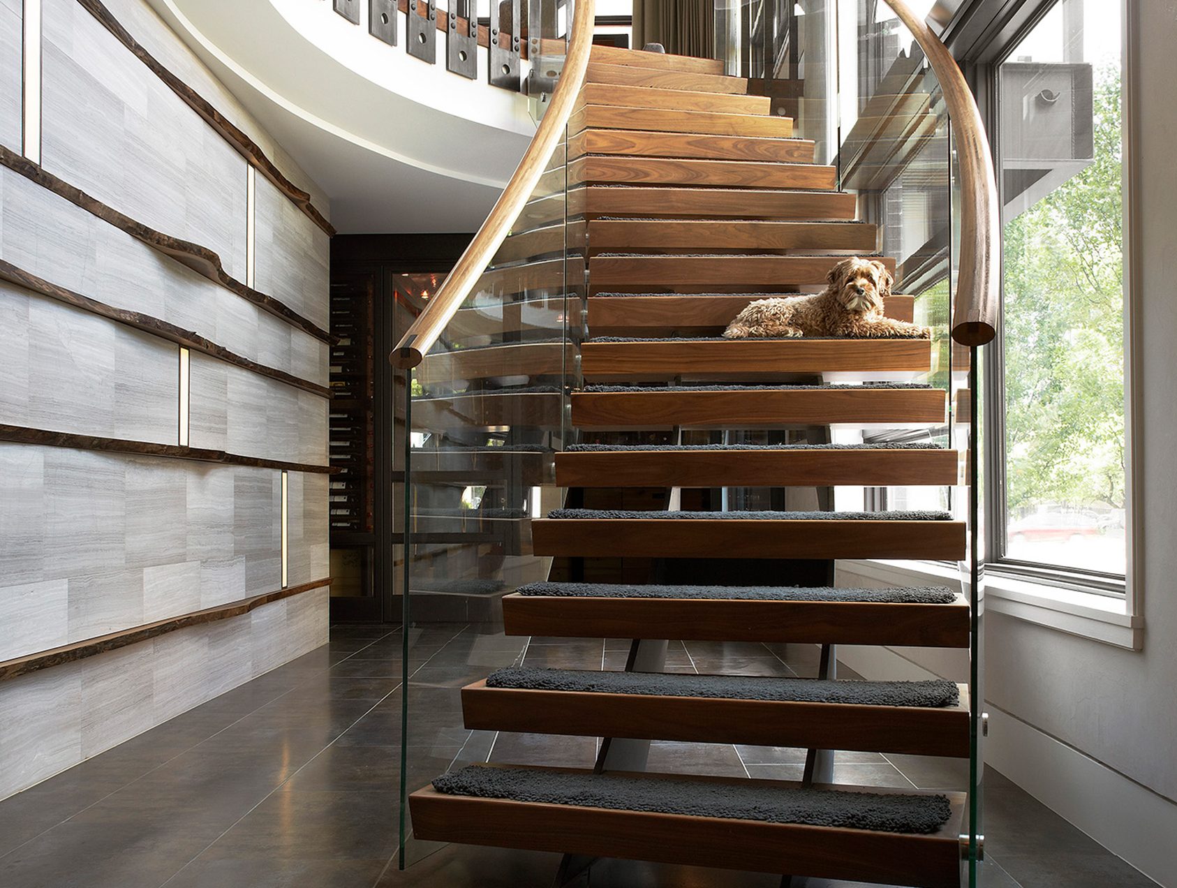 dramatic curved staircase in foyer